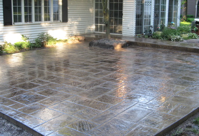 Kalamazoo stamped concrete job of a stamped patio outside a residential home in a subdivision. 