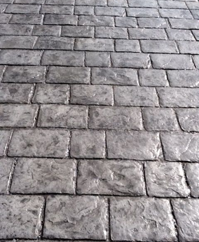 Custom brick design stamped cement driveway.